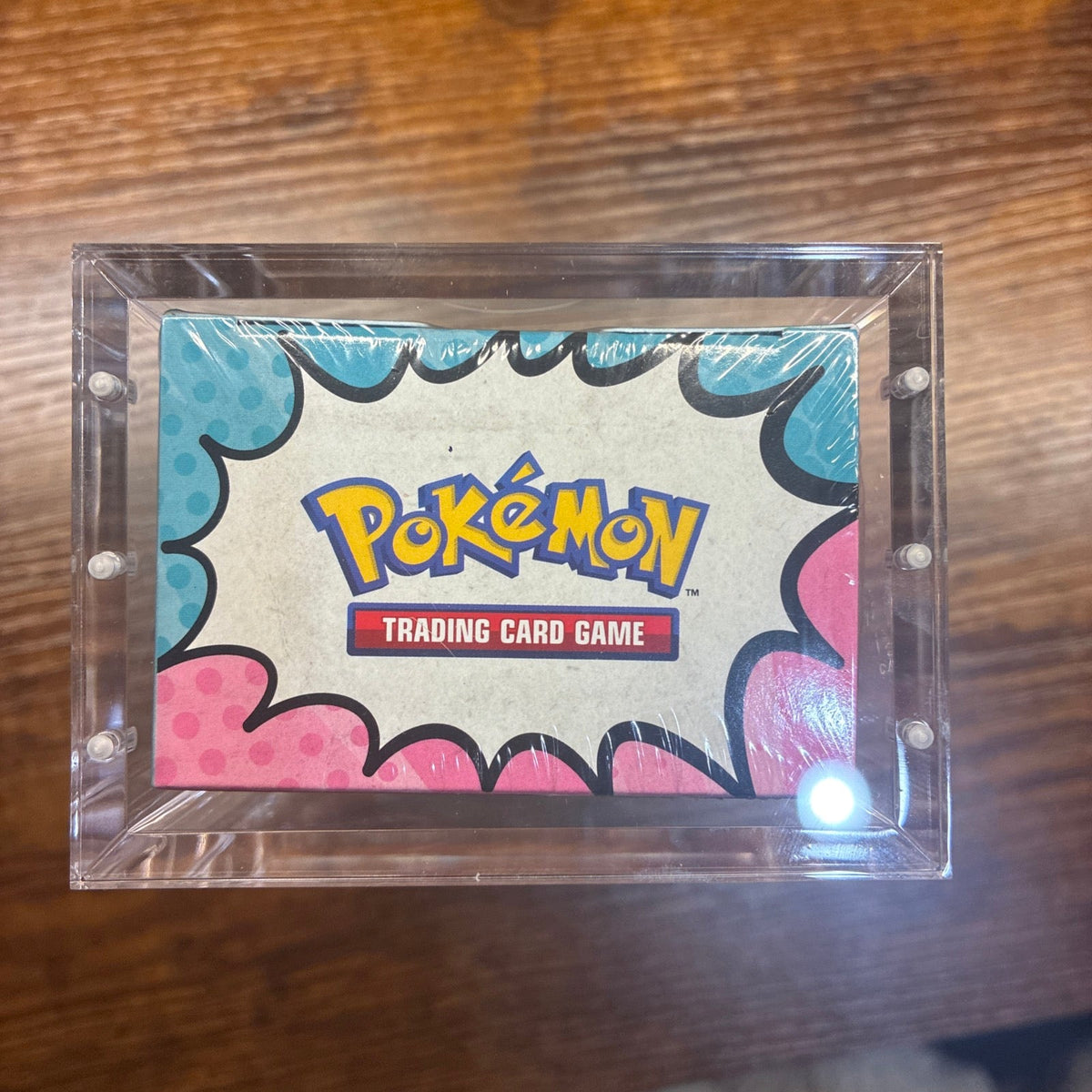 Top view of clear acrylic Booster Bundle display protector case